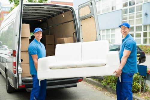Professional removals team loading boxes for a local move in Rainham