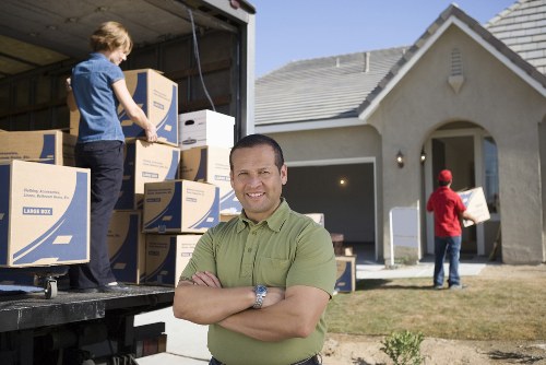 Local movers carrying furniture near Rainham homes