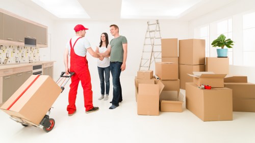 Packed boxes and furniture ready for removal truck hire